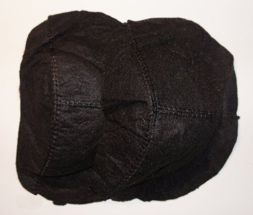 Close-up of a black raglan shoulder pad showing its shape.