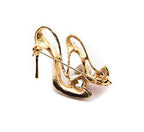 Close-up of elegant high heel shoes brooch showcasing intricate details.