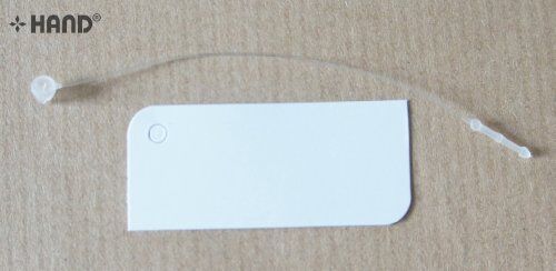 Stack of small white paper tags ready for use in various projects.