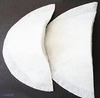 Shoulder pads positioned on a sewing table with tools