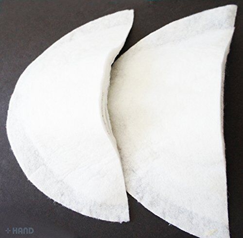 Two pairs of white canvas lined shoulder pads displayed