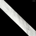 Off white delicate knitted flat elastic on a spool
