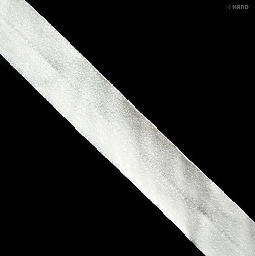 Off white delicate knitted flat elastic on a spool