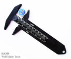 Close-up of the black button measurer's scale in mm
