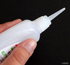 B502 Super Glue in use on a shoe repair project