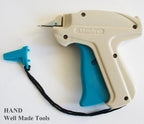 Tagging gun in use, attaching a tag to a garment