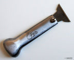 No.202 Metal Scraper Knife displayed on a workbench