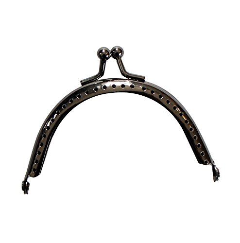 Close-up of the ball kiss clasp lock on the coin purse frame.