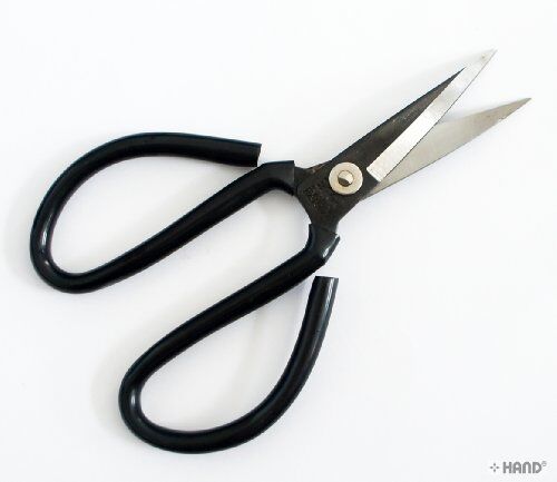 Close-up of curved blades of the cutting scissors