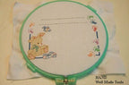 Cross Stitch Hoop displayed with colourful threads