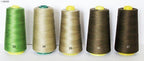 Close-up of military green polyester thread on a spool.