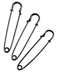 Three extra large dark copper kilt pins on a white background.