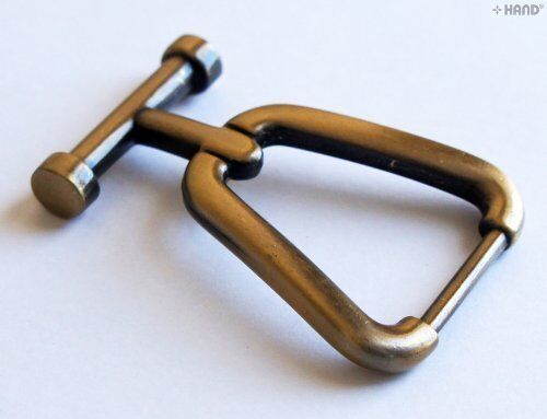 Front view of the vintage gold tone handbag buckle