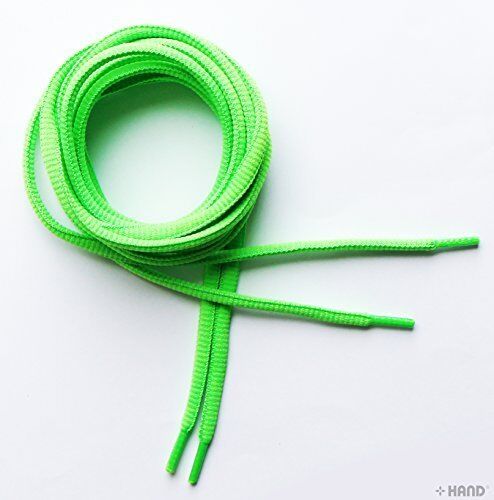 Close-up of neon green oval trainer shoe lace