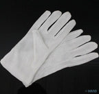 Hands wearing medium stretchable cotton gloves in use