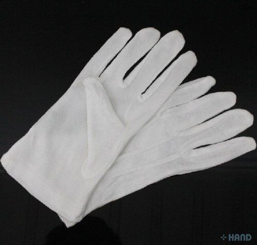 Hands wearing medium stretchable cotton gloves in use