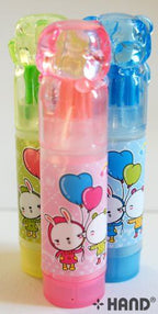 Children using teddy bear erasers with brushes in a classroom