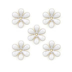 Small white enamel flower trim with brass backing.