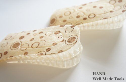 Pair of 4 cm silicon wedge heel cushions on a white background