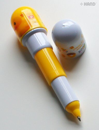 Pens in use on a colourful drawing pad