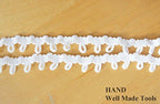 Close-up of white nylon loop trim showcasing its texture.