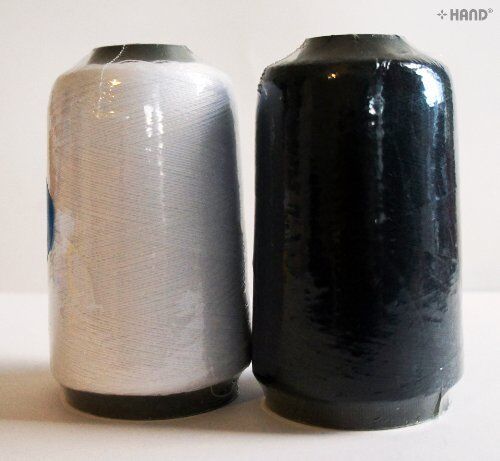 White sewing machine thread spool, approximately 500 m, free with purchase.