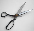 Scissors displayed on a cutting mat with fabric samples.