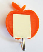 Self-adhesive hook displayed on a bathroom tile.