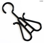Pack of 10 plastic black shoe display hangers on a rack
