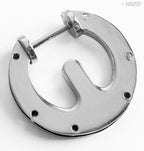 Handbag buckle displayed with a measuring tape for size reference.