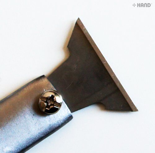 Close-up of the stainless steel blade of the scraper knife