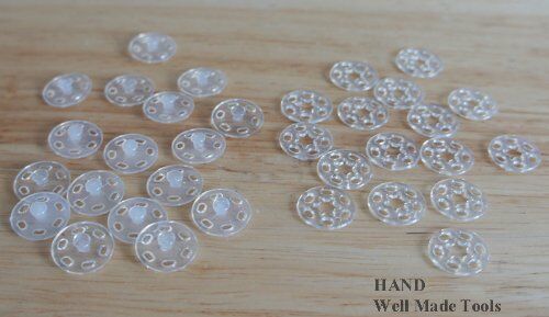 Clear plastic clip buttons arranged neatly for easy viewing.