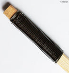 Shoe repair sanding tools in use on a shoe sole.