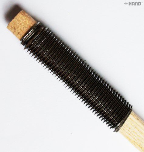 Shoe repair sanding tools in use on a shoe sole.