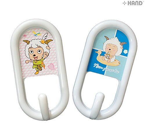 Children's stick on hooks displayed on a bathroom wall.