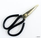 Scissors displayed with fabric and sewing supplies