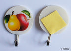 Self-adhesive hooks in use, showcasing their load capacity.