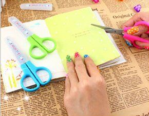 Close-up of the blunt tip scissors showing the ergonomic handle.