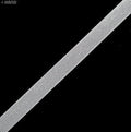 Off white stripy delicate thin flat underwear elastic on a roll.