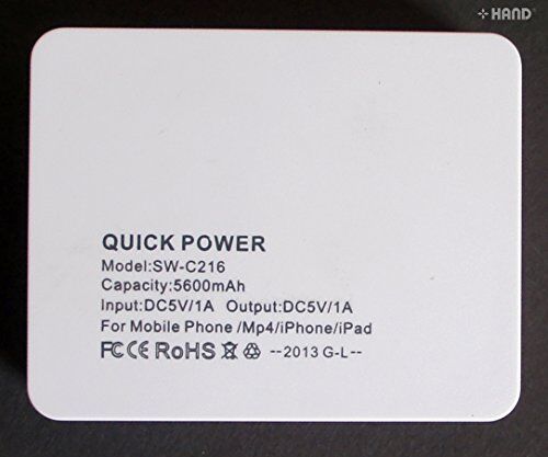 Power bank connected to a mobile phone for charging.