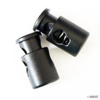 Close-up of a single plastic toggle spring stop cord lock