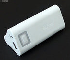 Portable power bank charging a mobile phone