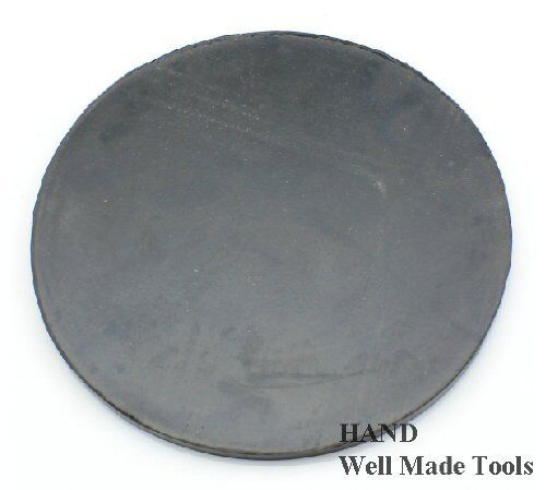 Close-up of a round black mat designed for fabric cutting applications.