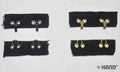 Heavy weight gold hook and eye tape displayed on a white background.
