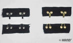 Heavy weight gold hook and eye tape displayed on a white background.