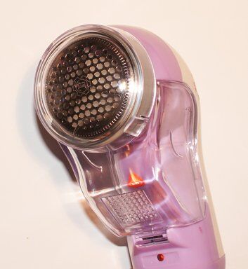 Mini cleaning brush included with the lint remover