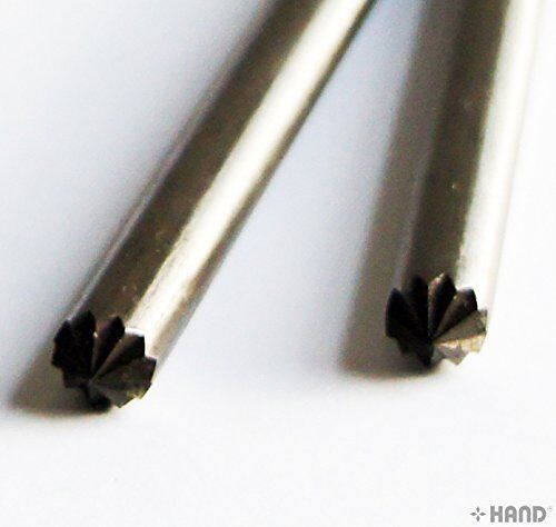 Close-up of a book binding eyelet opener showing its sharp tip.