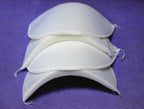 Close-up view of light weight shoulder pads in white.