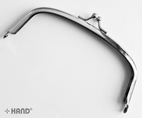 Close-up of the small ball kiss clasp on the purse frame