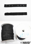Roll of black push button tape measuring 18mm wide.